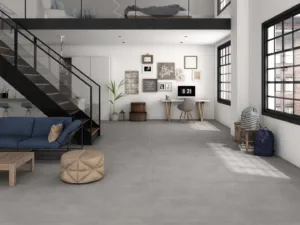 Ecoceramic Baltimore Ceniza Feinsteinzeug Fliese in moderner Betonoptik in einem stilvollen Wohnzimmer verlegt