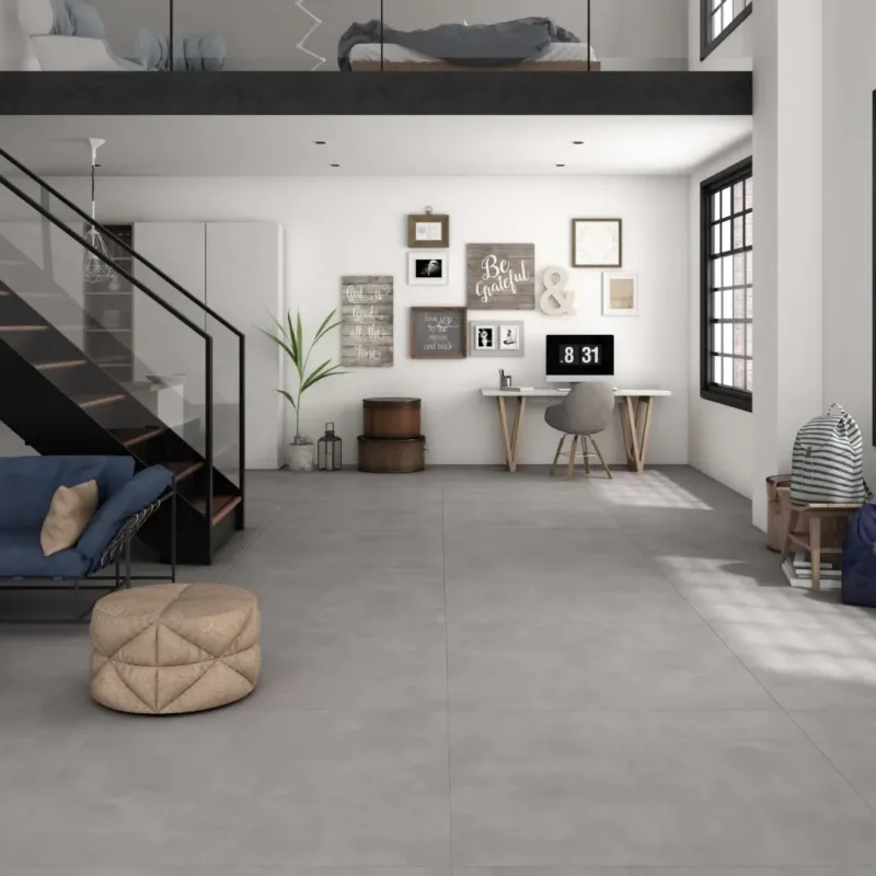 Ecoceramic Baltimore Ceniza Feinsteinzeug Fliese in moderner Betonoptik in einem stilvollen Wohnzimmer verlegt