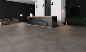 Wohnzimmer mit Ecoceramic Baltimore Marengo Feinsteinzeugfliesen in moderner Betonoptik
